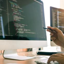 Student coding on computer