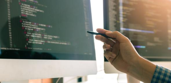 Student coding on computer