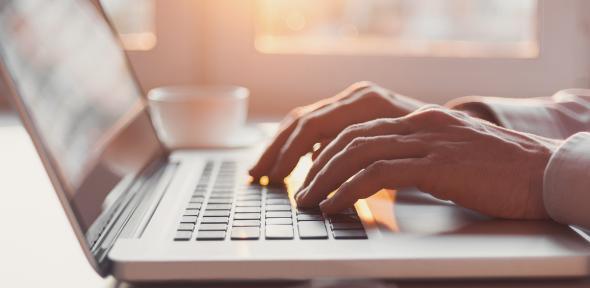 Person typing on laptop