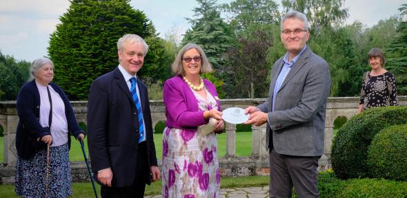 ICE and Madingley Hall staff receiving 30th anniversary plaque for National Garden Scheme